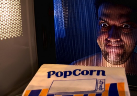 microwave popcorn PFC man face staring
